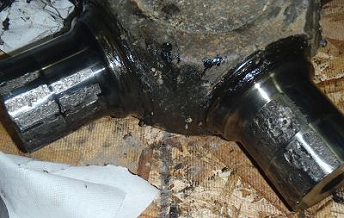 Note the damage caused by bearing failure on the U-Joint cross-arm.